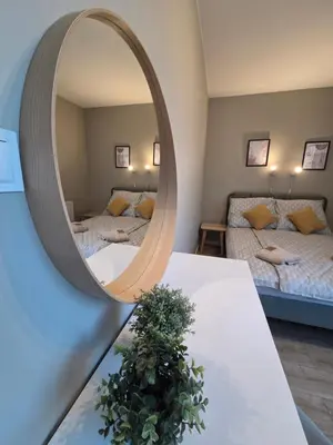 Łóżko lub łóżka w pokoju w obiekcie Apartament Centrum Krawiecka 1