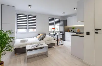 Łóżko lub łóżka w pokoju w obiekcie Matejki 17 Urban Studio Apartment ProperUNIT