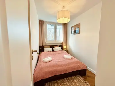 Łóżko lub łóżka w pokoju w obiekcie Surf Apartament Biskupin