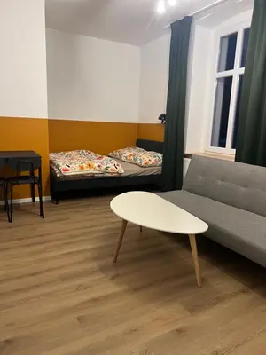 Łóżko lub łóżka w pokoju w obiekcie Apartamenty Cytryn