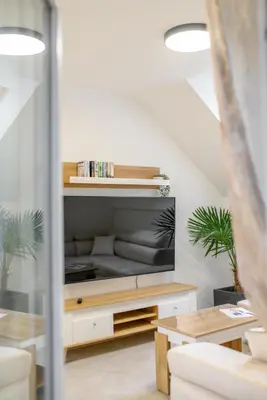 Telewizja i/lub zestaw kina domowego w obiekcie APARTAMENTY z GÓRSKIM KLIMATEM