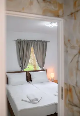 Łóżko lub łóżka w pokoju w obiekcie APARTAMENTY z GÓRSKIM KLIMATEM