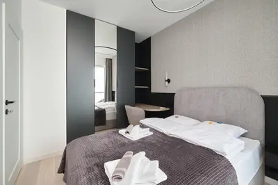 Łóżko lub łóżka w pokoju w obiekcie Platinum Apartment Quorum - Parking - Klimatyzacja - Self check in