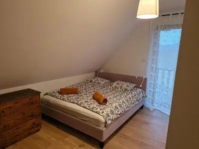 Łóżko lub łóżka w pokoju w obiekcie Czapliniec