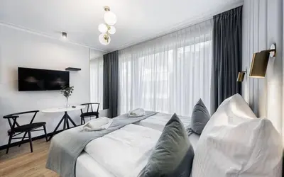 Łóżko lub łóżka w pokoju w obiekcie SkyLine Wroclove