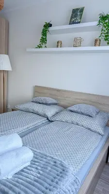 Łóżko lub łóżka w pokoju w obiekcie Apartament Ptasia Góra