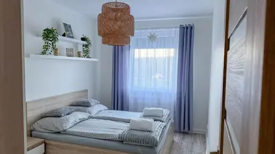 Łóżko lub łóżka w pokoju w obiekcie Apartament Ptasia Góra