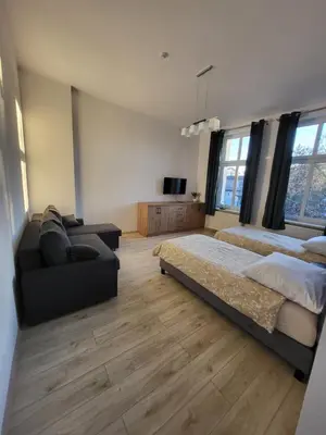 Łóżko lub łóżka w pokoju w obiekcie AS ELITE Apartament Kozielska parking