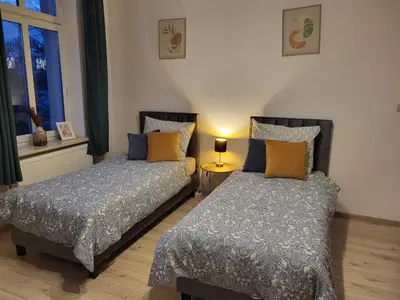 Łóżko lub łóżka w pokoju w obiekcie AS ELITE Apartament Kozielska parking
