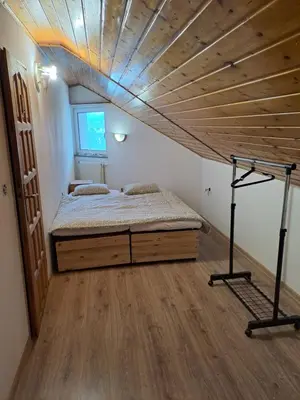 Łóżko lub łóżka w pokoju w obiekcie Szafirowy Pensjonat Pracowniczy