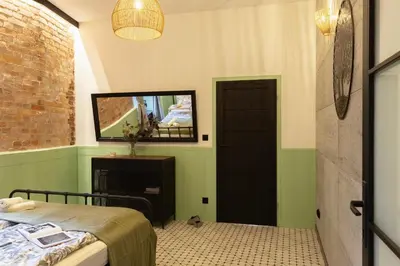 Łóżko lub łóżka w pokoju w obiekcie Antoniego Loft Apartment