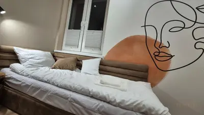 Łóżko lub łóżka w pokoju w obiekcie Black Hill Pod Zieleńcem Apartament BOHO Nr6 z Sauną