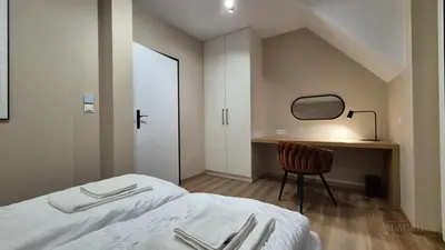 Łóżko lub łóżka w pokoju w obiekcie Black Hill Pod Zieleńcem Apartament BOHO Nr6 z Sauną