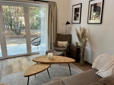 Część wypoczynkowa w obiekcie Whispering Woods Cabin