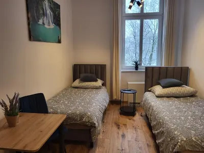 Łóżko lub łóżka w pokoju w obiekcie AS ELITE Apartament -Studio Centrum parking