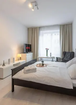Łóżko lub łóżka w pokoju w obiekcie Brązowa City Comfort Apartment ProperUNIT