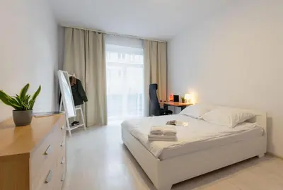 Łóżko lub łóżka w pokoju w obiekcie Brązowa City Comfort Apartment ProperUNIT