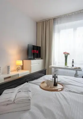Łóżko lub łóżka w pokoju w obiekcie Brązowa City Comfort Apartment ProperUNIT