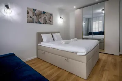 Łóżko lub łóżka w pokoju w obiekcie RentPlanet - Studio Oleśnicka