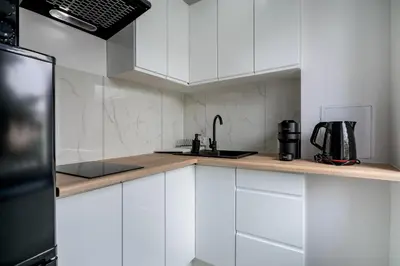 Kuchnia lub aneks kuchenny w obiekcie RentPlanet - Studio Oleśnicka