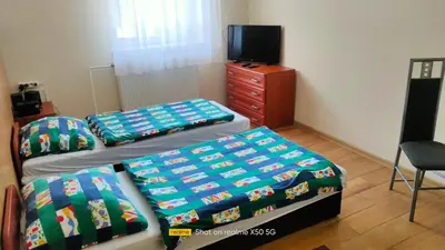 Łóżko lub łóżka w pokoju w obiekcie Gościniec Iwona II