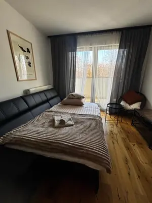 Łóżko lub łóżka w pokoju w obiekcie Green Port Loft Apartament 2-pokojowy z balkonem i garażem podziemnym