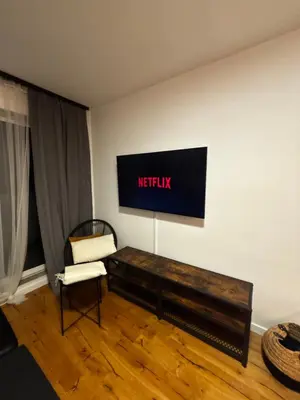 Telewizja i/lub zestaw kina domowego w obiekcie Green Port Loft Apartament 2-pokojowy z balkonem i garażem podziemnym