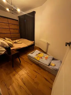 Łóżko lub łóżka w pokoju w obiekcie Green Port Loft Apartament 2-pokojowy z balkonem i garażem podziemnym