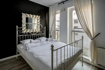 Łóżko lub łóżka w pokoju w obiekcie RentPlanet - Apartament Jedności Narodowej
