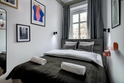 Łóżko lub łóżka w pokoju w obiekcie RentPlanet - Apartament Nadodrze