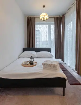Łóżko lub łóżka w pokoju w obiekcie Kościuszki 83 Comfort Apartment Garage & Balcony ProperUNIT