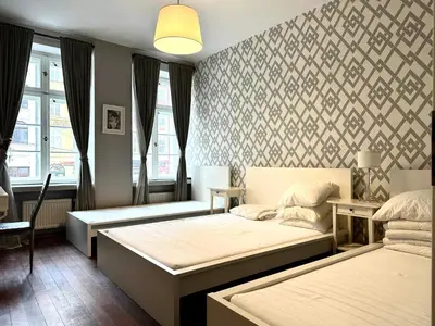 Łóżko lub łóżka w pokoju w obiekcie Ratusz 15 Apartment - On Main Square
