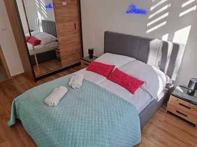 Łóżko lub łóżka w pokoju w obiekcie Apartament City Dream