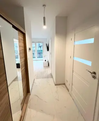 Łóżko lub łóżka w pokoju w obiekcie Apartamenty Sienkiewicza Residence 1