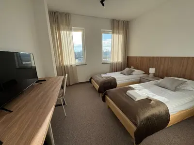 Łóżko lub łóżka w pokoju w obiekcie Pokoje Dębowa Góra