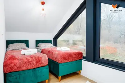Łóżko lub łóżka w pokoju w obiekcie Wilcza Osada Resort