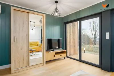 Telewizja i/lub zestaw kina domowego w obiekcie Wilcza Osada Resort