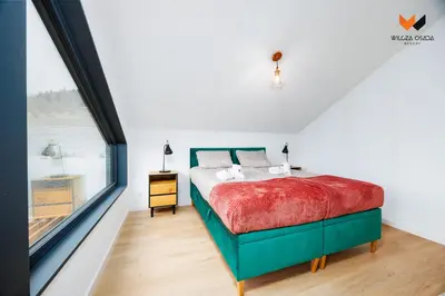 Łóżko lub łóżka w pokoju w obiekcie Wilcza Osada Resort