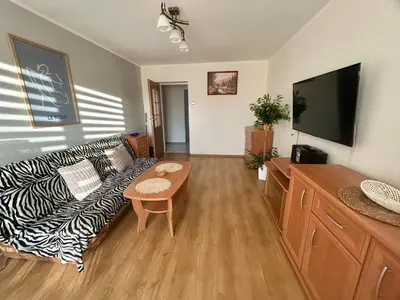 Telewizja i/lub zestaw kina domowego w obiekcie Apartament T Joanna blisko dworca