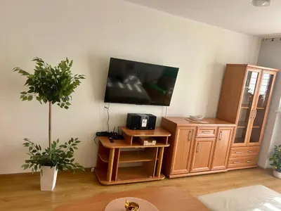 Telewizja i/lub zestaw kina domowego w obiekcie Apartament T Joanna blisko dworca
