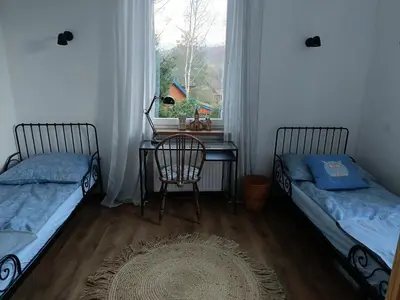 Łóżko lub łóżka w pokoju w obiekcie Apartament w Starej Szkole