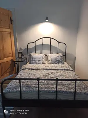 Łóżko lub łóżka w pokoju w obiekcie Apartament w Starej Szkole