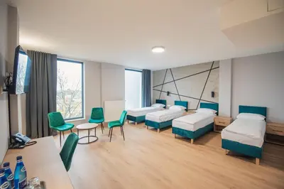 Łóżko lub łóżka w pokoju w obiekcie Centrum Szkoleniowo - Rekreacyjne '5 poziom'