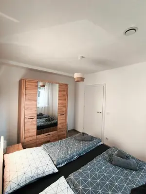 Łóżko lub łóżka w pokoju w obiekcie Apartament Parkowa