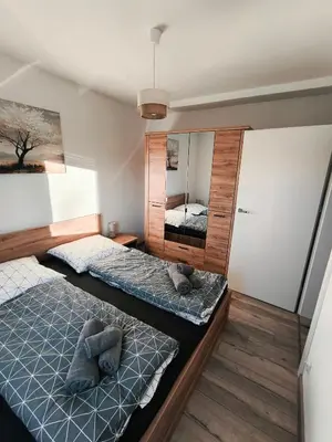 Łóżko lub łóżka w pokoju w obiekcie Apartament Parkowa