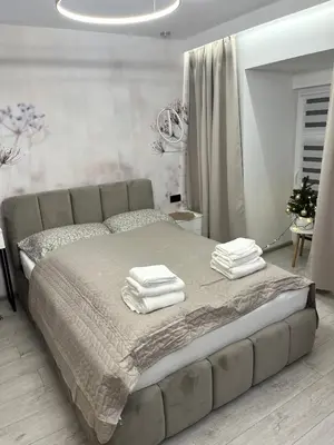Łóżko lub łóżka w pokoju w obiekcie Apartament Bursztynowy