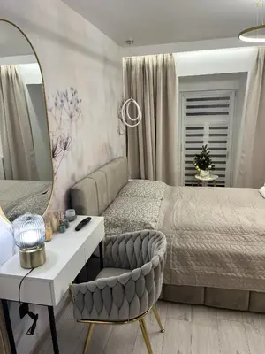 Łóżko lub łóżka w pokoju w obiekcie Apartament Bursztynowy