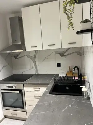 Kuchnia lub aneks kuchenny w obiekcie Apartament Bursztynowy