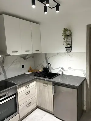 Kuchnia lub aneks kuchenny w obiekcie Apartament Bursztynowy