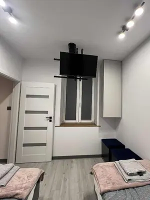 Łóżko lub łóżka w pokoju w obiekcie Apartament Centrum Kłodnicka